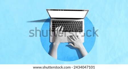 Person using a laptop computer - crumpled paper background
