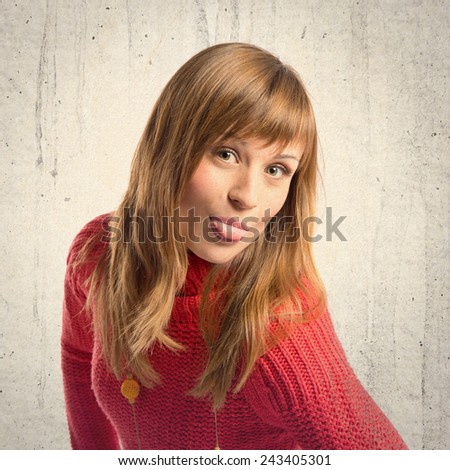 Young girl doing a joke over textured background 