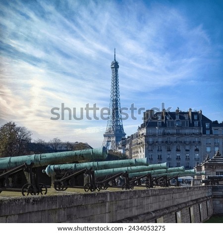 Paris, the esplanade des Invalides, with cannons, and the Eiffel Tower in background, touristic place