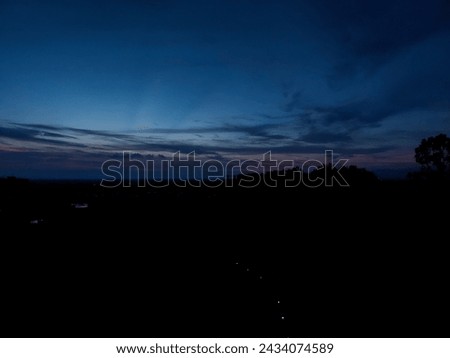 Night sky background, sunset wallpaper, nature photography, dark clouds in blue sky over the city 