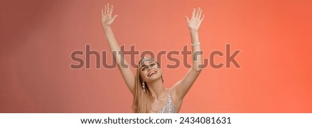 Lifestyle. Girl dancing having fun standing fan-zone party enjoying awesome concert favorite singer in silver glittering elegant dress raise hands up waving palms moving music rhythm smiling delighted