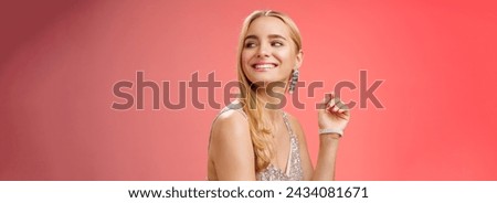 Elegant glamour gorgeous young rich blond woman attend charity party in stylish silver glittering dress accessorize turning right smiling greeting familiar person grinning joyfully, red background.