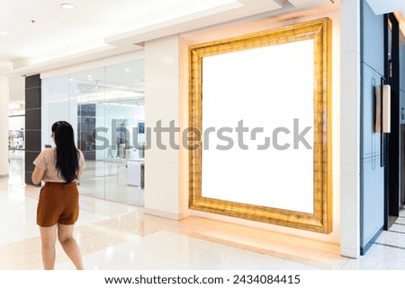 Mock up blank large billboard with clipping path on glassy showcase window in shopping mall interior. Empty space for insert advertising graphic design.