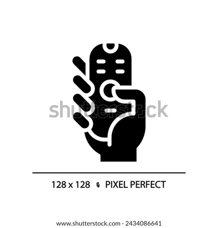 Hand with remote control pixel perfect black glyph icon. Digital device with keys. Contactless infrared gadget. Silhouette symbol on white space. Solid pictogram. Vector isolated illustration