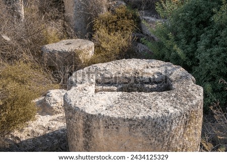 ancient stone millstones found at excavations next to Khirbet Midras, Judean Hills, Israel Royalty-Free Stock Photo #2434125329
