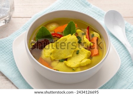Turmeric chicken soup, hot and sour soup in southern Thai cuisine style. Turmeric makes the dish look yellowish and provides aroma. This tangy dish is easy to make, but delicious.