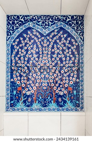Mosaic wall with floral geometric ornaments. Background with traditional tile decorations. Detail of traditional mosaic wall with geometrical and floral ornament UAE. Vertical frame with ceramic tile
