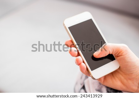Woman holding smartphone