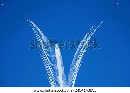 The most spectacular formation maneuver
 of aerobatics at Dubai Air Show. Royalty-Free Stock Photo #2434143835