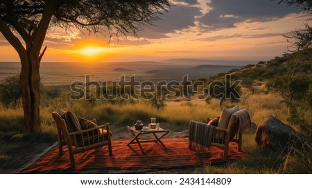Safari Lodge Sunset with Elephant View, A serene sunset view from a safari lodge balcony overlooking a landscape graced by grazing elephants Royalty-Free Stock Photo #2434144809