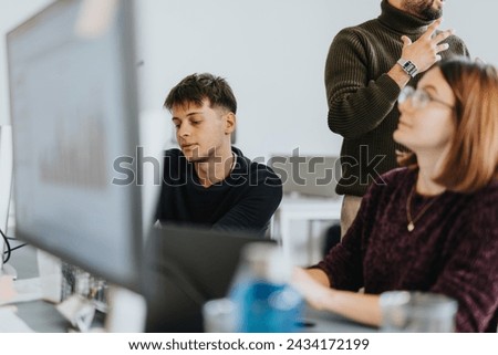 Business professionals collaborating for successful growth, analyzing stats, discussing projects, and working together in a cozy workplace. Royalty-Free Stock Photo #2434172199