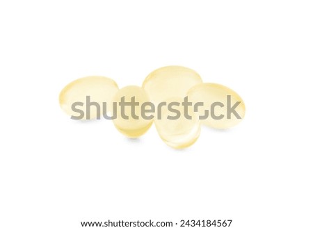 Many vitamin capsules isolated on white. Health supplements