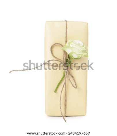 Gift box with beautiful rose flower on white background. International Women's Day