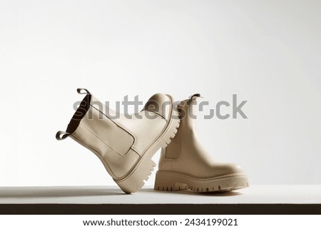 Trendy leather boots. fashion female shoes still life. stylish chelsea boots