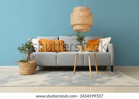 Interior of living room with cozy sofa and lamp
