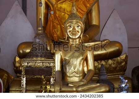 Ancient old buddha in antique ruin ubosot of Wat Nang Kui Monastery Temple for thai people travelers travel visit and respect praying blessing wish myth holy mystical worship in Ayutthaya, Thailand
