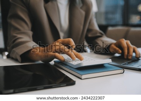 Business team working with new startup project plan and discussion information for financial strategy with laptop and digital tablet in a modern business lounge.