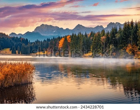 Calm morning scene of Wagenbruchsee lake with Kaltwasserkar Spitze mountain range on background. Misty autumn sunrise in Bavarian Alps, Germany, Europe. Beauty of nature concept background.
 Royalty-Free Stock Photo #2434228701