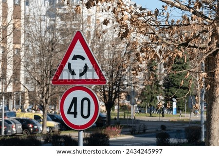 Traffic signs near roundabout, roundabout danger sign and speed limit 40