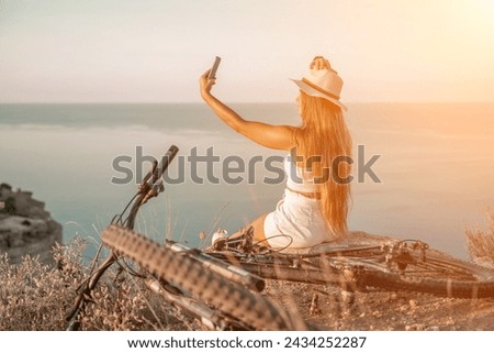 Selfie woman in cap and tank top making selfie shot mobile phone post photo social network outdoors on sea background beach people vacation lifestyle travel concept.