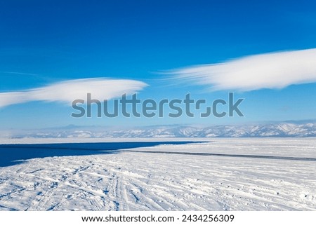 Lake Baikal in winter, the deepest and largest freshwater lake by volume in the world, located in southern Siberia, Russia Royalty-Free Stock Photo #2434256309