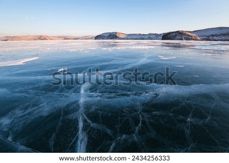 Ice of Lake Baikal, the deepest and largest freshwater lake by volume in the world, located in southern Siberia, Russia Royalty-Free Stock Photo #2434256333