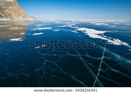 Ice of Lake Baikal, the deepest and largest freshwater lake by volume in the world, located in southern Siberia, Russia Royalty-Free Stock Photo #2434256341