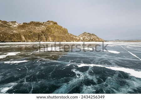 Lake Baikal in winter, the deepest and largest freshwater lake by volume in the world, located in southern Siberia, Russia Royalty-Free Stock Photo #2434256349