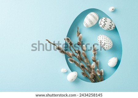 Charming Easter design idea: top view showcasing delicate pussy willows and decorated eggs, seen through an egg-shaped opening on a pastel blue canvas, space for message or ad