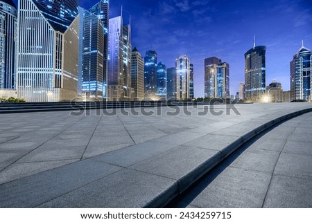 City square floor and modern commercial building scenery at night in Shanghai. Famous financial district buildings in Shanghai. Royalty-Free Stock Photo #2434259715