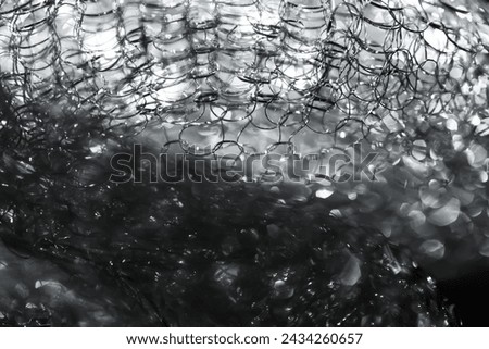 Abstract background. Tangled wire close-up. Blurred glitter texture. Macro picture. Selective soft focus