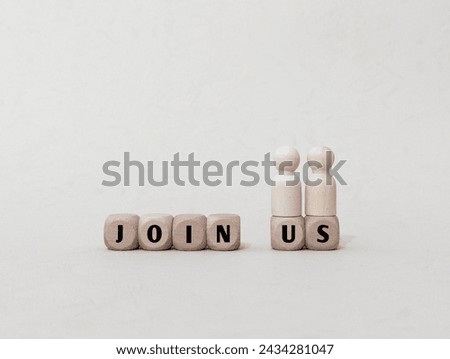 Wooden figure of people and cube with  Join Us text on wooden cubes. recruitment concept. 