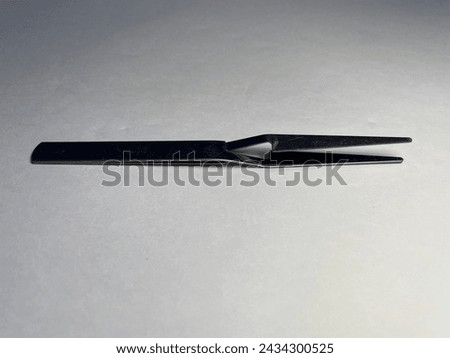 The small workpiece picker makes it easy to pick up the workpiece. Royalty-Free Stock Photo #2434300525