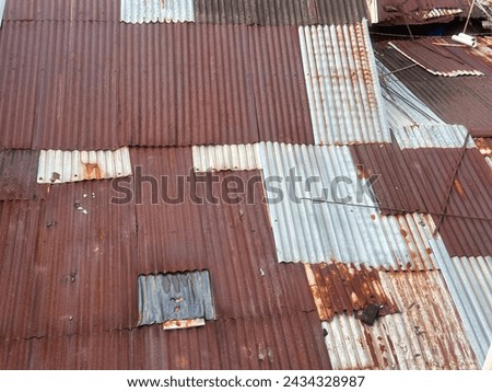 a picture of a rusty tin roof of a house
