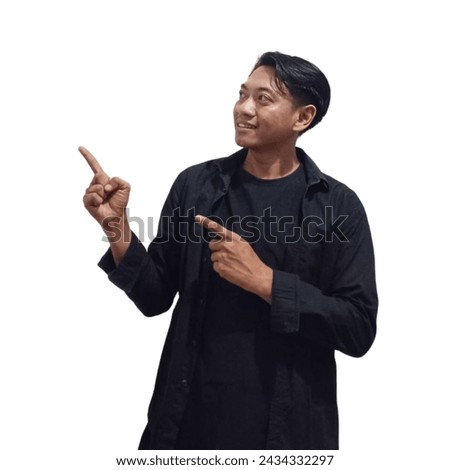 Photo of cheerful asian young man smiling beaming showing fingers empty space isolated on white color background