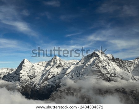 Jungfrau, Monch, and Eiger from Schilthorn, Murren, in Switzerland Royalty-Free Stock Photo #2434334371