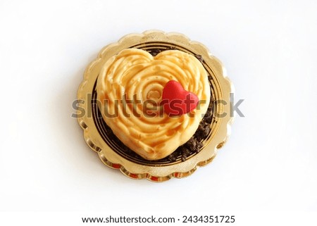 One heart - shaped Valentine's day dessert isolated on white background. Valentine's day celebration. Overhead view. Copy space. 