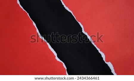 Torn red paper sheet isolated on black background Royalty-Free Stock Photo #2434366461