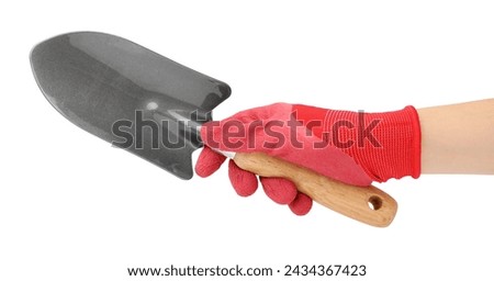 Woman in gardening glove holding trowel on white background, closeup Royalty-Free Stock Photo #2434367423