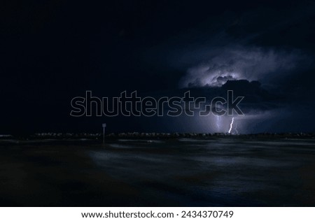 Bellaria, Italy - AUGUST,23,2020:  Lightning, off the Adriatic Sea, preceding a large storm arriving on the Romagna Riviera.