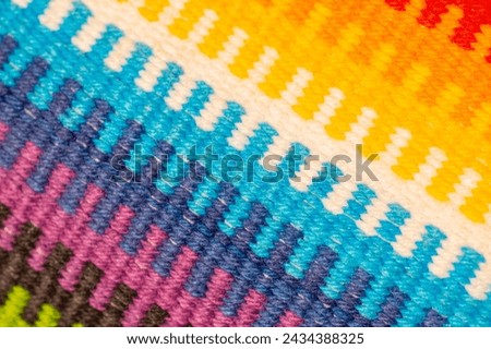 The kilim rug made of different color crewels
