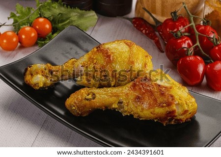 Roasted Chicken leg drumsticks with curry sauce appetizer Royalty-Free Stock Photo #2434391601