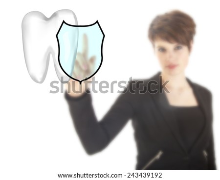 Young woman with tooth shield symbol isolated on white background