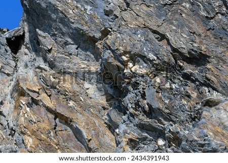 Stone pattern, granite rock surface, colored rock detail texture, tashkaya vein structures, marble granite deposit