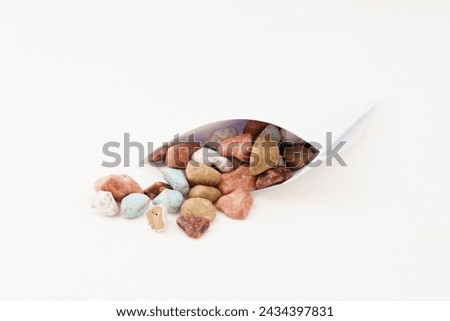 Multiple stone candies on white background