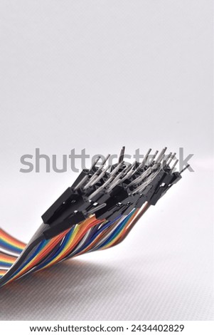 Colorful wires for micro-controller on the white background Royalty-Free Stock Photo #2434402829