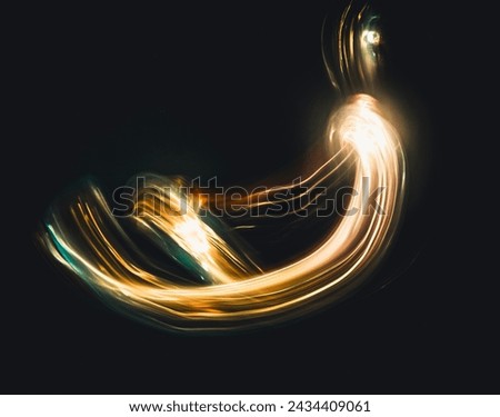Long exposure photography with the lightpainting technique. Light painting in the dark. Abstract lines of light.