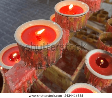 This picture is a red candle in temple.