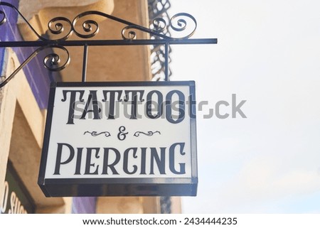 Skyhigh signage on building facade tattoo piercing shop