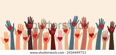 Raised hands of volunteer people holding a heart. People diversity. Charitable and donation. Support and assistance. Multicultural community. NGO. Aid. Help. Volunteerism.Teamwork. Banner Royalty-Free Stock Photo #2434449711